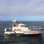 Coast Guard, harbormaster work to secure dredging barges after heavy weather breaks barge free from mooring in Gloucester Harbor