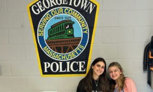 Georgetown Police Repaint Station Garage with Help from Georgetown Middle High School Seniors